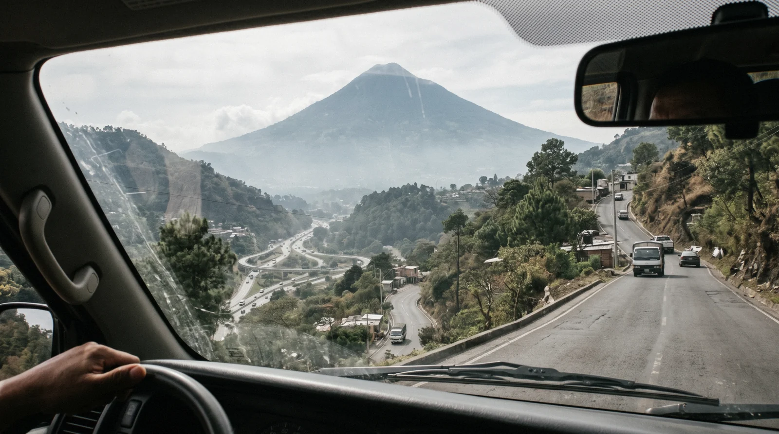 A shuttle van waiting outside La Aurora arrivals for the run to Antigua Guatemala