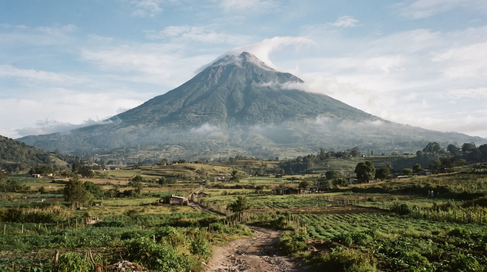 Volcán de Agua rising over the red rooftops and colonial streets of Antigua Guatemala